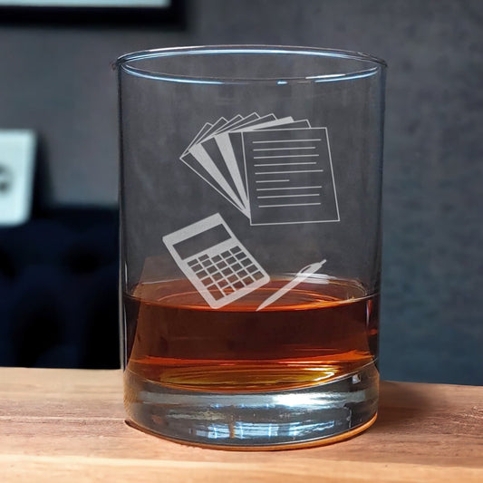 13oz Whiskey Glass with an etched image of sheets of paper, a pen, and a calculator - Copyright Hues in Glass