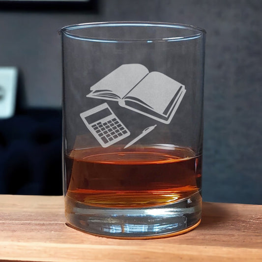13oz Whiskey Glass with an etched image of an open blank book, a pen, and a calcultor - Copyright Hues in Glass