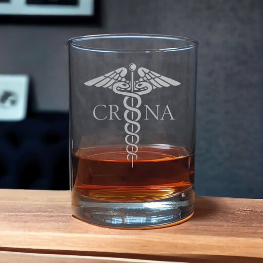 Certified Registered Nurse Anesthetist Whiskey Glass with a etched image of a Caduceus and the designation letters C R N A on either side of it - Copyright Hues in Glass