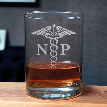 Registered Nurse Whiskey Glass with a etched image of a Caduceus and the designation letters R N on either side of it - Copyright Hues in Glass