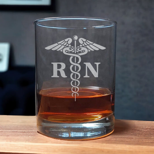 Advanced Practice Registered Nurse Whiskey Glass with a etched image of a Caduceus and the designation letters A P R N on either side of it - Copyright Hues in Glass