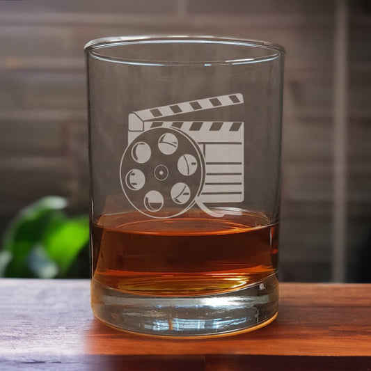 13oz Whiskey Glass with an etched image of a film reel and clapper - Copyright Hues in Glass