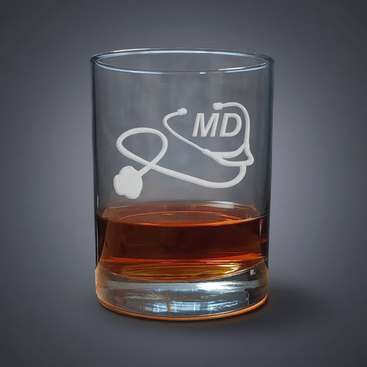 Clear glass with 'MD' and stethoscope design, filled with a dark liquid