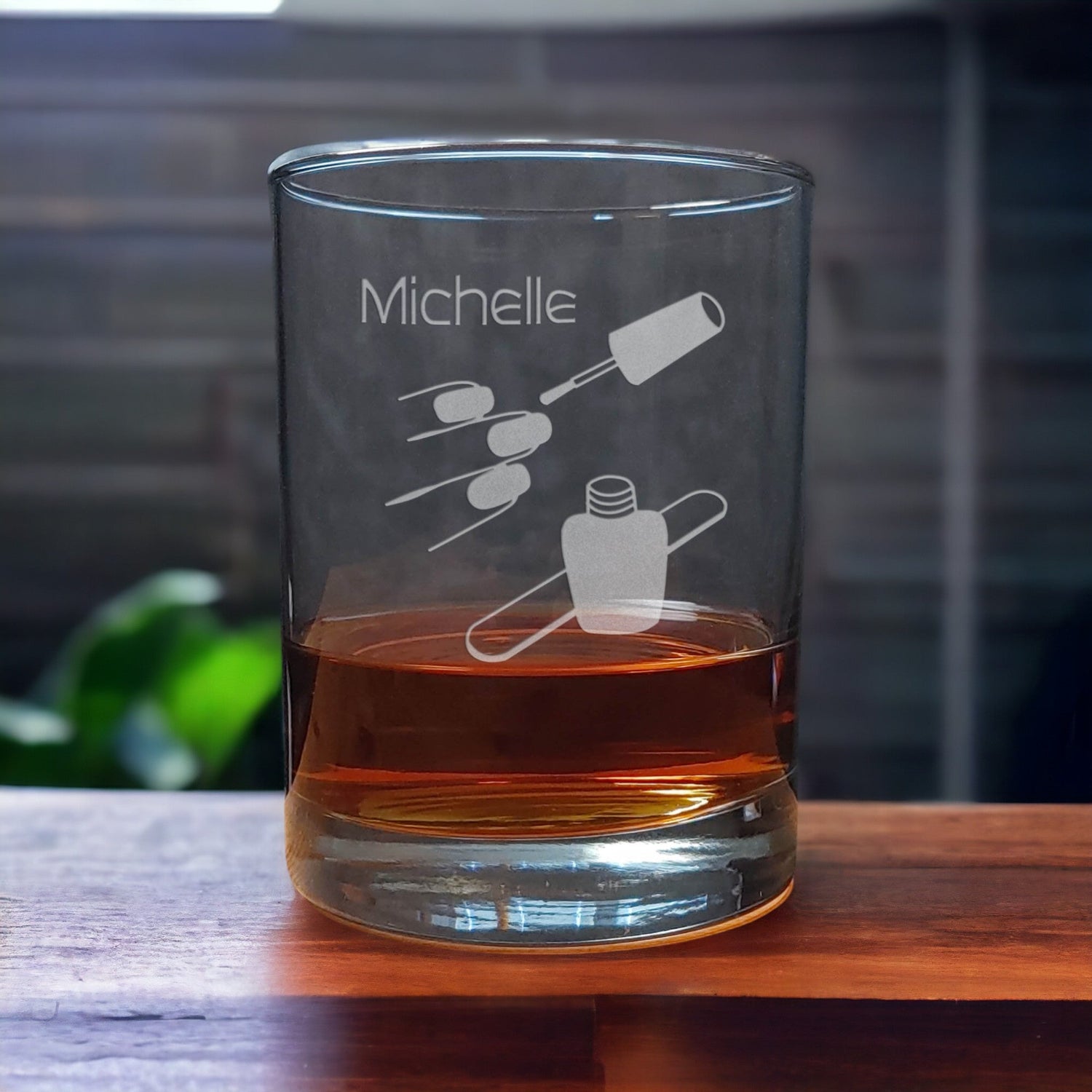 Personalized 13oz Whiskey Glass with an etched image of finger nails, and a bottle of nail polish and emery board