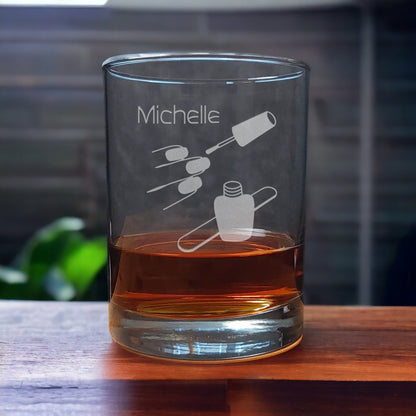 Personalized 13oz Whiskey Glass with an etched image of finger nails, and a bottle of nail polish and emery board