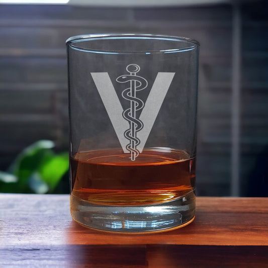 Whiskey Glass with a etched image of the veterinarian insignia - Copyright Hues in Glass