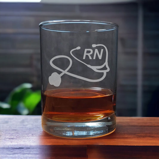 Registered Nurse Whiskey Glass with a etched image of a Stethoscope and the designation letters R N on  it - Copyright Hues in Glass