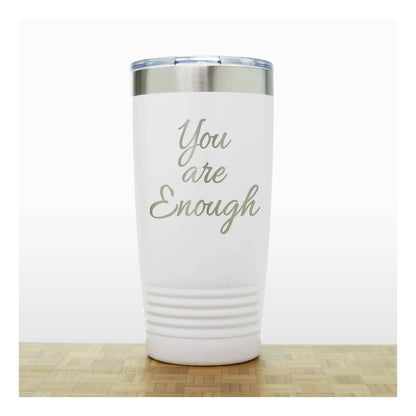 White tumbler with laser engraved 'You are Enough' text on a white background