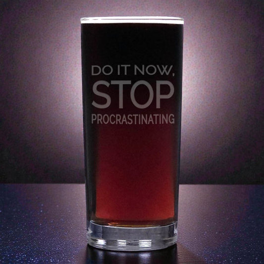 Glass with red liquid and motivational text on a dark background