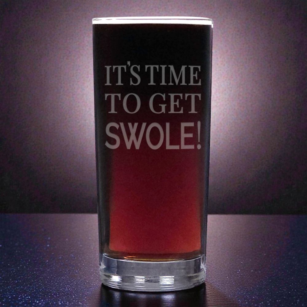 Glass with red liquid and 'IT'S TIME TO GET SWOLE!' text on a dark background