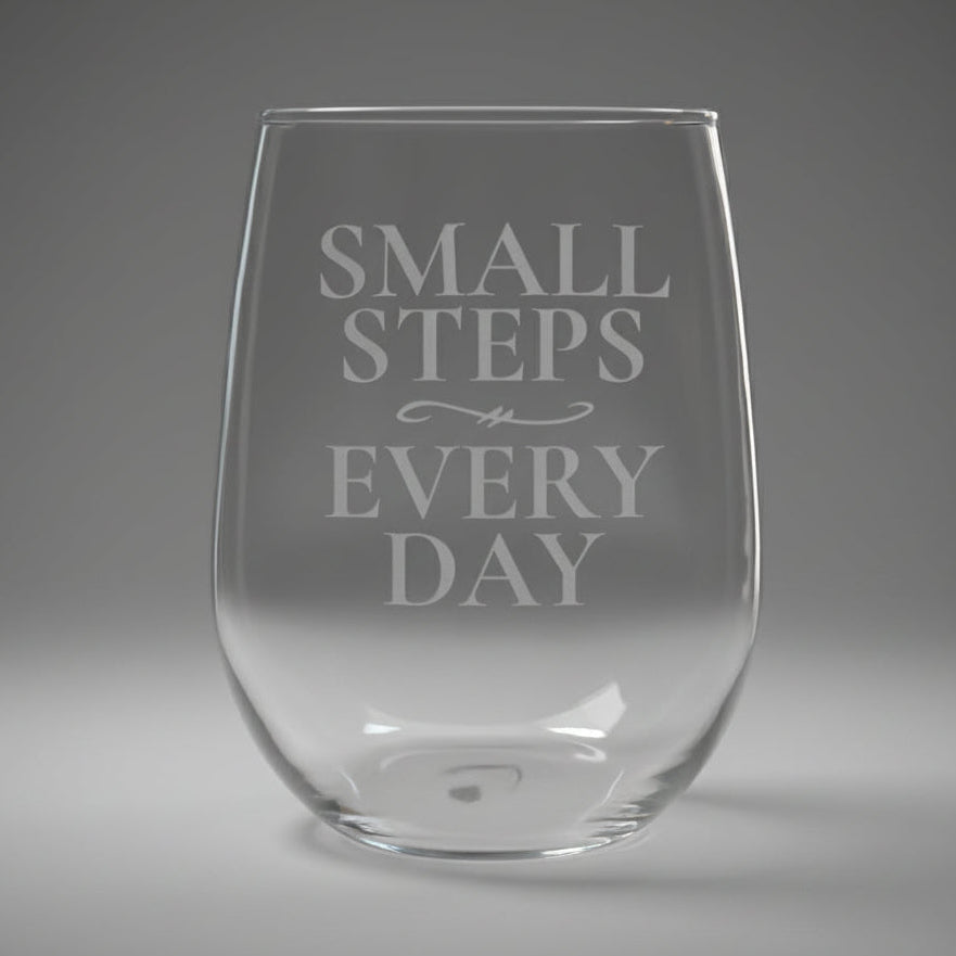 Clear stemless glass with 'Small Steps Every Day' text 