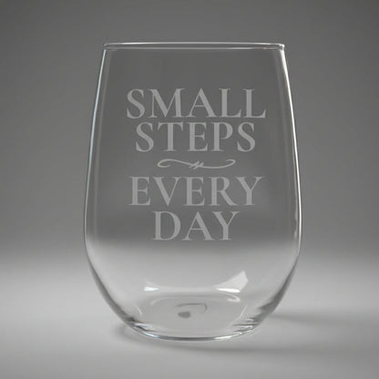 Clear stemless glass with 'Small Steps Every Day' text 