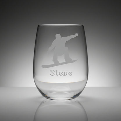 Clear glass with a snowboarder silhouette and 'Steve' engraved on a wooden surface with black background