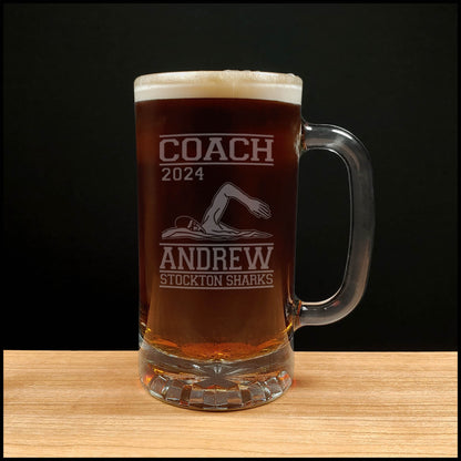 Swimming 16oz beer mug with an image of a Swimmer doing the crawl stroke with the word Coach, the Name, team and the year - Copyright Hues in Glass