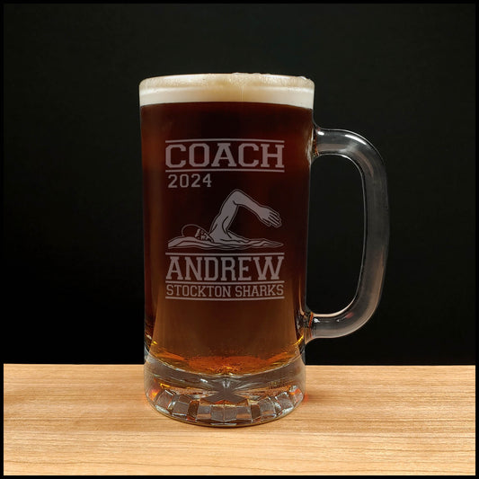 Swimming 16oz beer mug with an image of a Swimmer doing the crawl stroke with the word Coach, the Name, team and the year - Copyright Hues in Glass