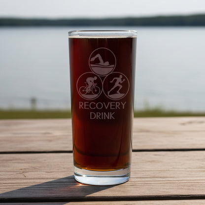 Triathlon Glass with 'Recovery Drink' in upper case text 