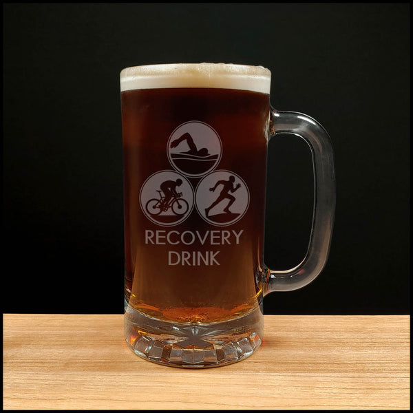 Triathlon 16oz beer mug with an image of a swimmer, cyclist, and runner and the words Recovery Drink - Copyright Hues in Glass