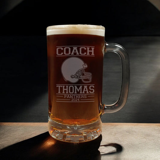A beer mug with an image of a Football Helmet - copyright Hues in Glass