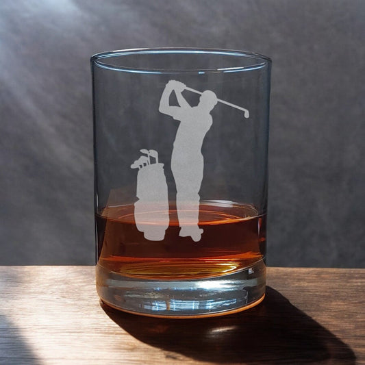 A 13 oz Whisky Glass with an etched golfer and golf bag - Copyright Hues in Glass
