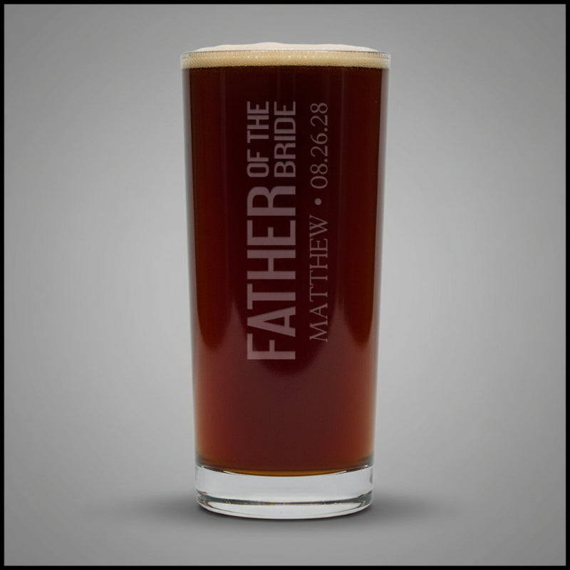 Personalized glass with 'Father of the Bride' text on a gray background