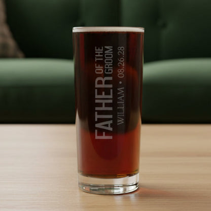 Personalized glass with 'Father of the Bride' text with a green couch in the background 