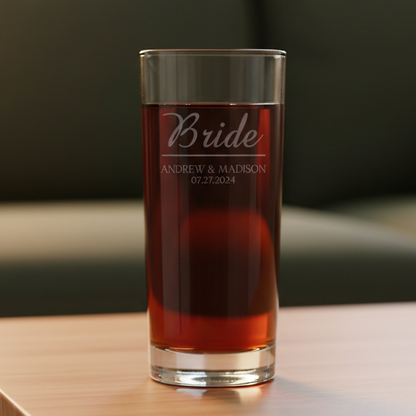 Personalized cooler glass with 'Bride' and names and date etched  with a green couch in the background