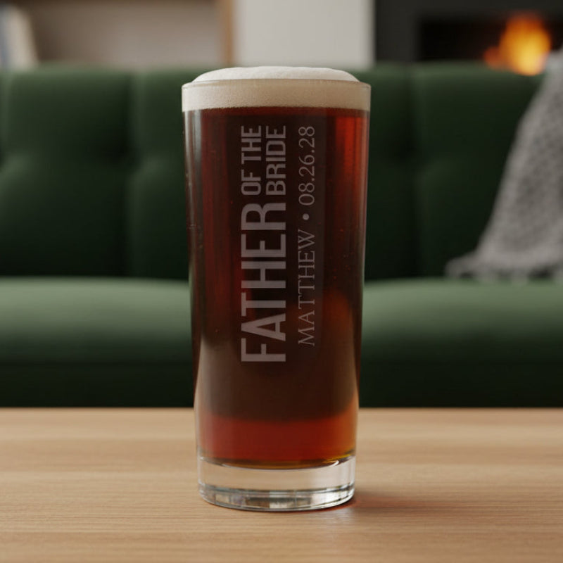 Personalized glass with 'Father of the Bride' text with a green couch in the background