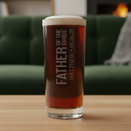 Personalized glass with 'Father of the Bride' text with a green couch in the background