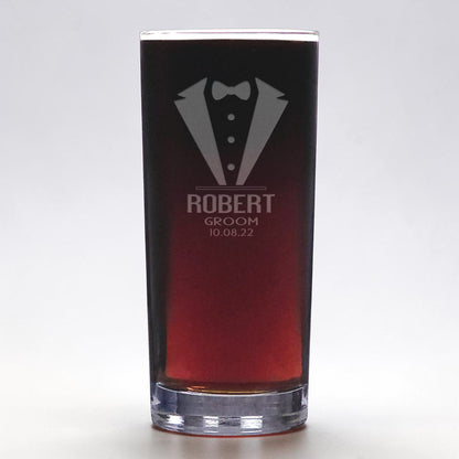 Glass with tuxedo design and text on a white background