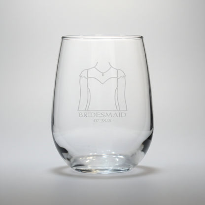 Clear glass with engraved design of a wedding dress and text on a white background