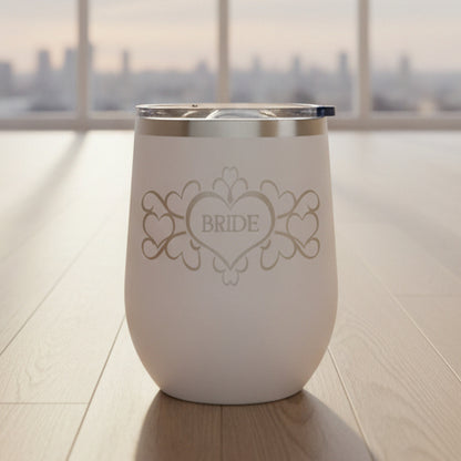 White wine tumbler with 'Bride' design on a wooden floor.