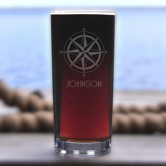 Black glass with compass design and 'Johnson' text on a blurred background